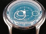 a close up of a watch in a black box