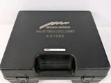 a black briefcase that is sitting on a white surface
