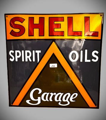 un panneau sur lequel est inscrit « Shell Spirit Oils Garage »