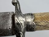 a close up view of a sword with a handle