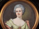 portrait of a lady in a green dress with a gold frame