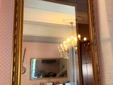 a mirror hanging on the wall in a room