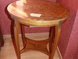 a wooden table with a wooden top on a hard wood floor