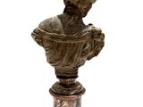 statue of a bust of a man on a marble pedestal