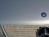 a close up of a mercedes emblem on a car
