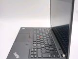 a black laptop with a red button on the keyboard