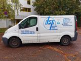 a white van that is parked in front of a building