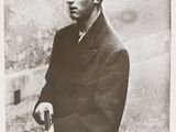 black and white photograph of a man with a gun in his hand