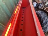 an image of a truck with a red bed in the back of it