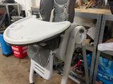 a baby high chair that is in the garage