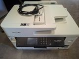 a printer that is sitting on top of a table