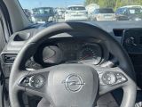 dashboard of a car with a steering wheel and dashboard gauges