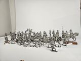 many figurines of soldiers on display in a studio