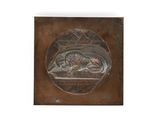 bronze plaque depicting a man and a dog in a field