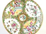 a plate that has a picture of people on it