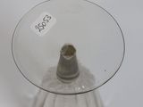 a glass vase that has a small piece of glass in it