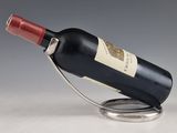 a bottle of wine that is sitting on a stand