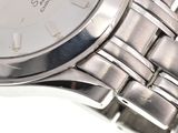 a close up of a wrist watch on a white surface