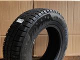 tires are stacked on a cardboard box in front of a cardboard box