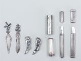 a lot of silver objects that are on the table