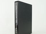 the front of a black book with a white title on it