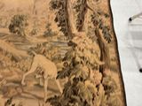 a picture of a wall hanging with a dog and a bird on it