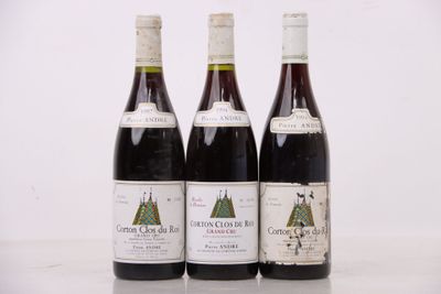 trois bouteilles de vin posées sur une table l'une à côté de l'autre