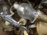 a box full of antique glass and metal items