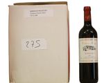 a bottle of wine sitting next to a box of wine