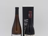 two bottles of wine sitting next to each other on a table