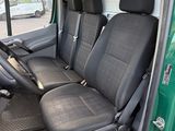 four seats in the back of a green van