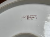 a close up of a white plate with writing on it