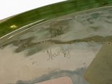 a glass bowl with a note on it and a sticker in it