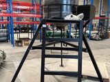 a ladder that is sitting in the middle of a warehouse