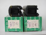 two boxes that have some type of camera on top of them