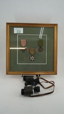 a picture of a framed picture with a pair of binoculars next to it