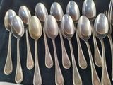 a lot of spoons that are sitting on a table