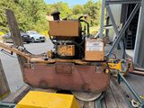 a machine that is sitting on a pallet in the parking lot