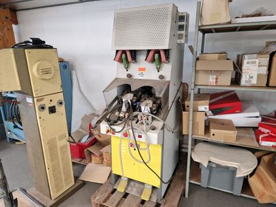a refrigerator and a refrigerator freezer in a garage