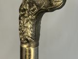 a close up of a cane with a dog head on it