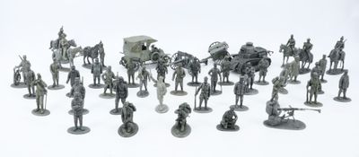 many figurines of different types and sizes on a white surface
