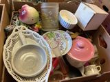 a box full of dishes and cups and bowls