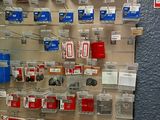a man that is standing in front of a wall of electronics