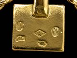 a gold padlock on a chain with a chain around it