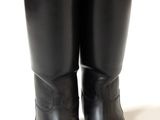 pair of black leather riding boots on a white background