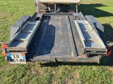 a truck with a flat bed on the back of it