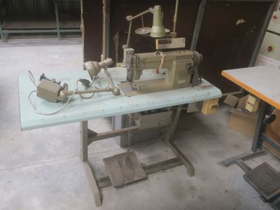a sewing machine sitting on a table in a room