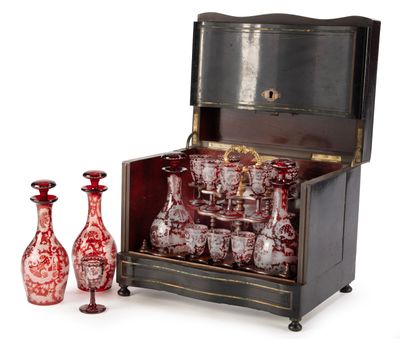 bottles and vases are sitting in front of an antique chest