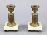 pair of antique brass candlesticks on marble bases