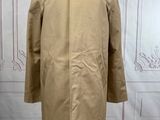 a beige coat on a mannequin mannequin mannequin mannequin mannequin mannequin mannequin mannequin mannequin